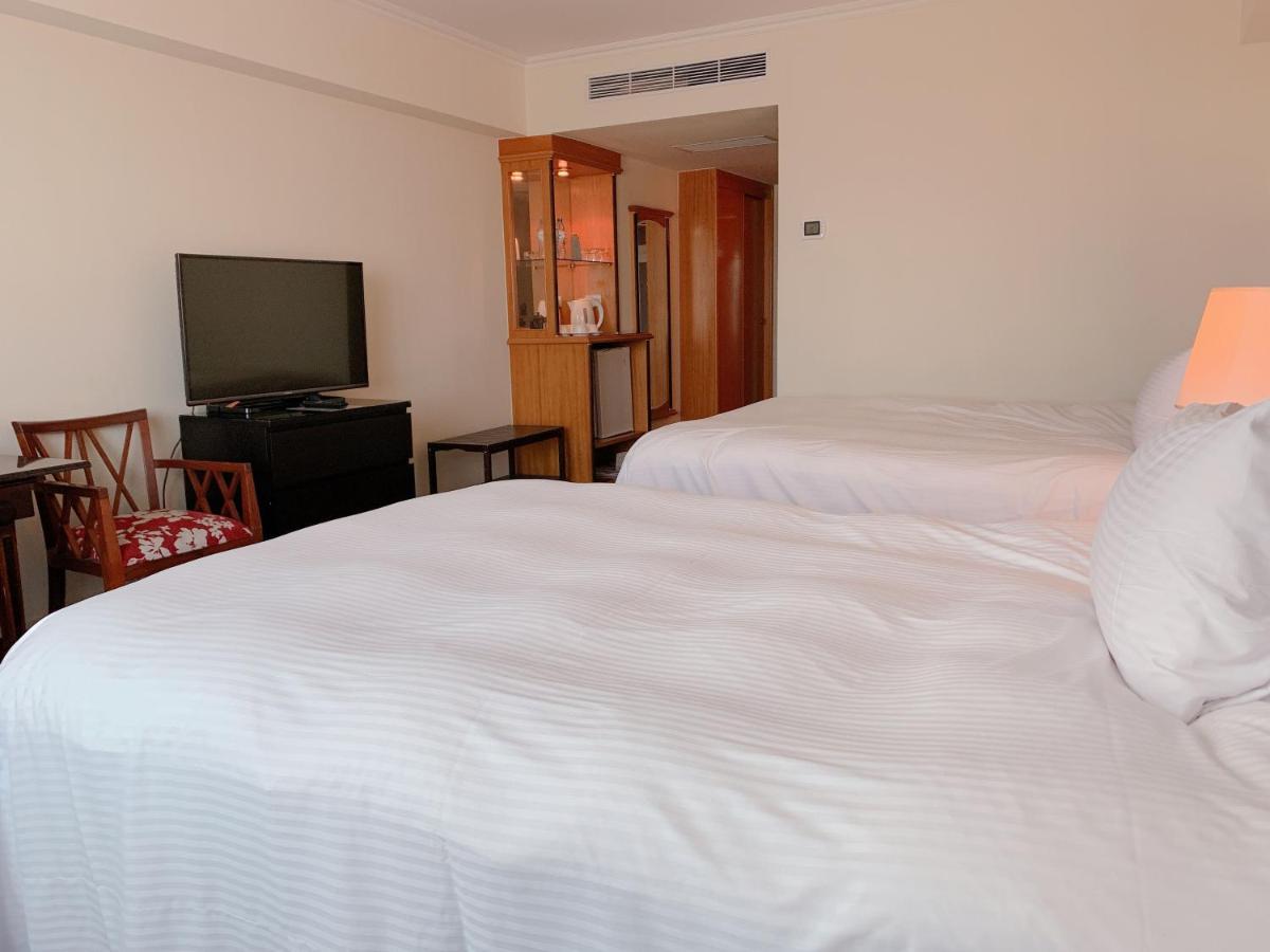 The Howard Plaza Hotel Гаосюн Экстерьер фото A room at the hotel